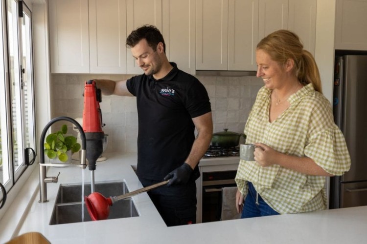 Svens Plumbing staff fixing a blocked drain