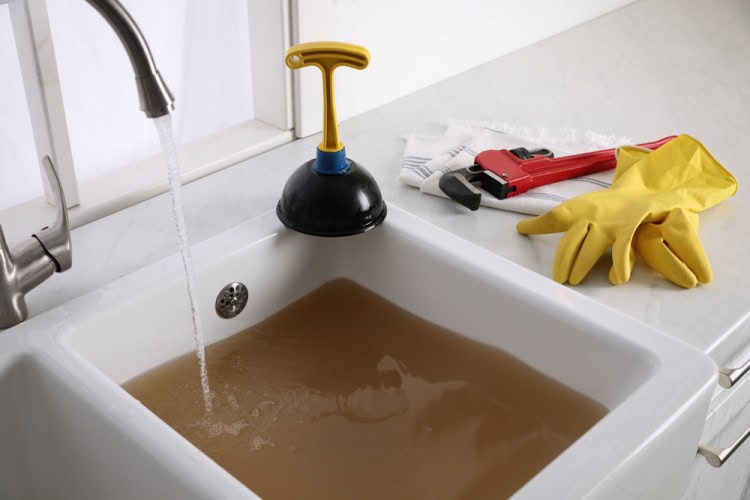 Kitchen sink water overflow due to blocked drain